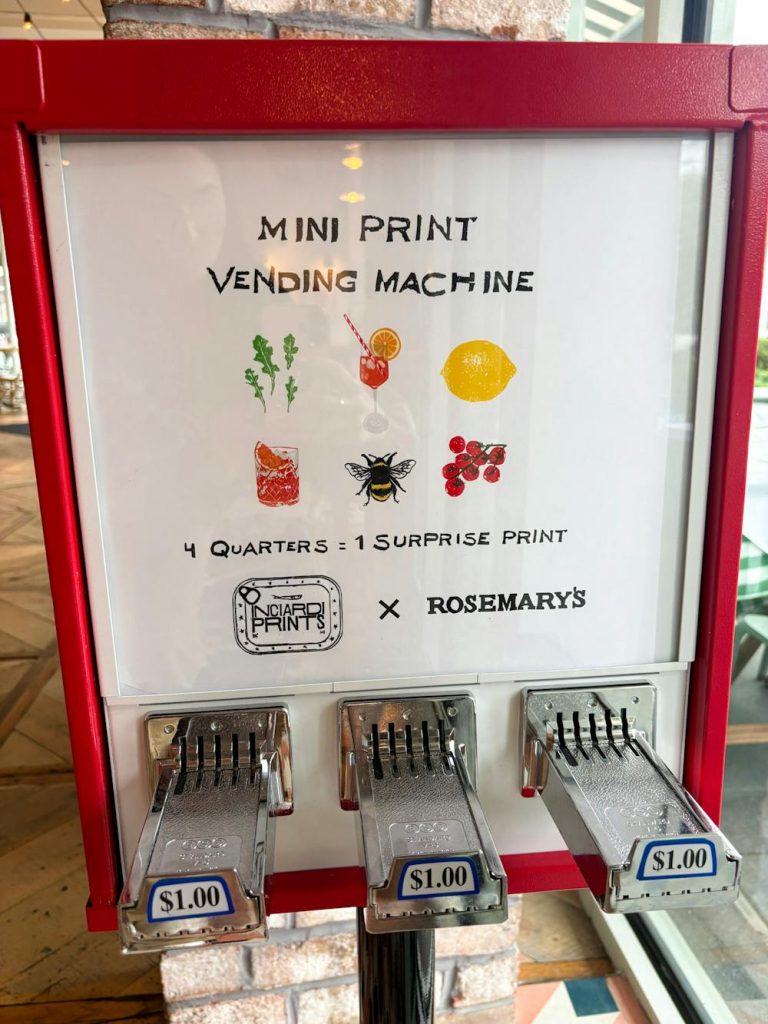 The Ana Inciardi mini print vending machine tucked into the pantry nook at Rosemary's East